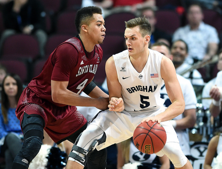 Kyle Collinsworth #5 of the Brigham Young Cougars is guarded by Jarvis Pugh #4 of the Santa Clara Broncos during a quarterfinal game of the West Coast Conference Basketball tournament at the Orleans Arena on March 7, 2015 in Las Vegas, Nevada. Brigham Young won 78-76. (Getty)