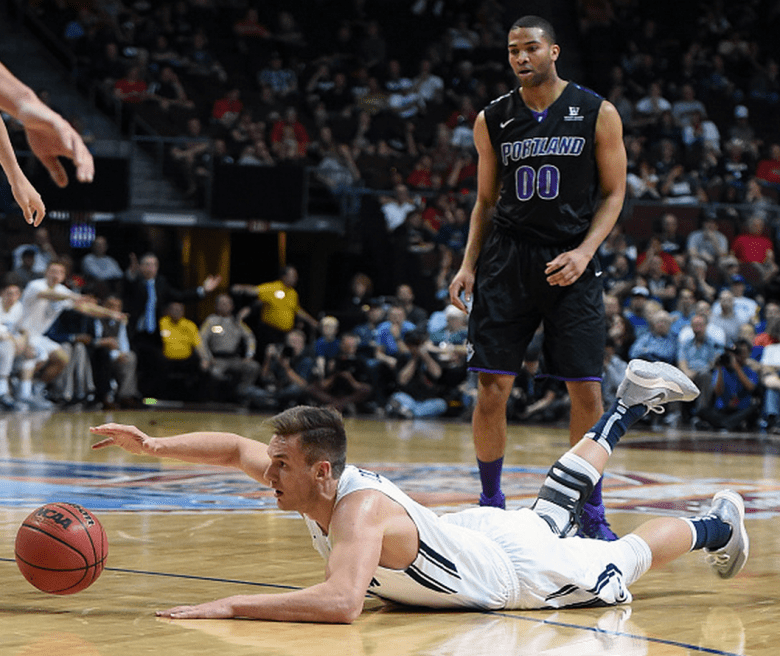Kyle Collinsworth #5 of the Brigham Young Cougars loses the ball in front of Kevin Bailey #00 of the Portland Pilots during a semifinal game of the West Coast Conference Basketball tournament at the Orleans Arena on March 9, 2015 in Las Vegas, Nevada. (Getty)
