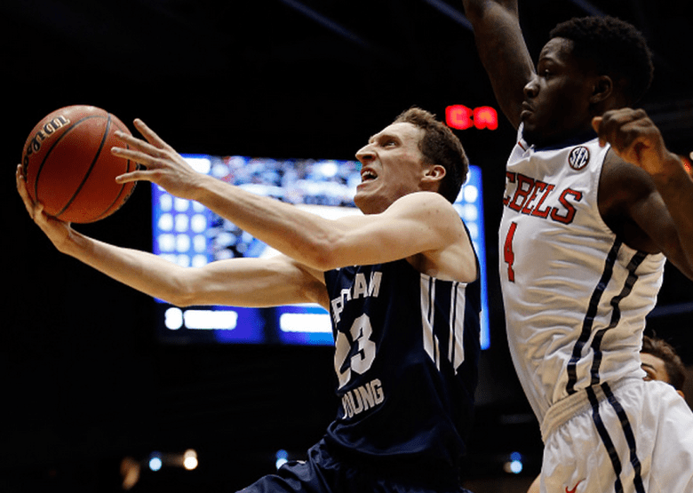Skyler Halford #23 of the Brigham Young Cougars goes to the basket as M.J. Rhett #4 of the Mississippi Rebels defends during the first round of the 2015 NCAA Men's Basketball Tournament at UD Arena on March 17, 2015 in Dayton, Ohio. (Getty)