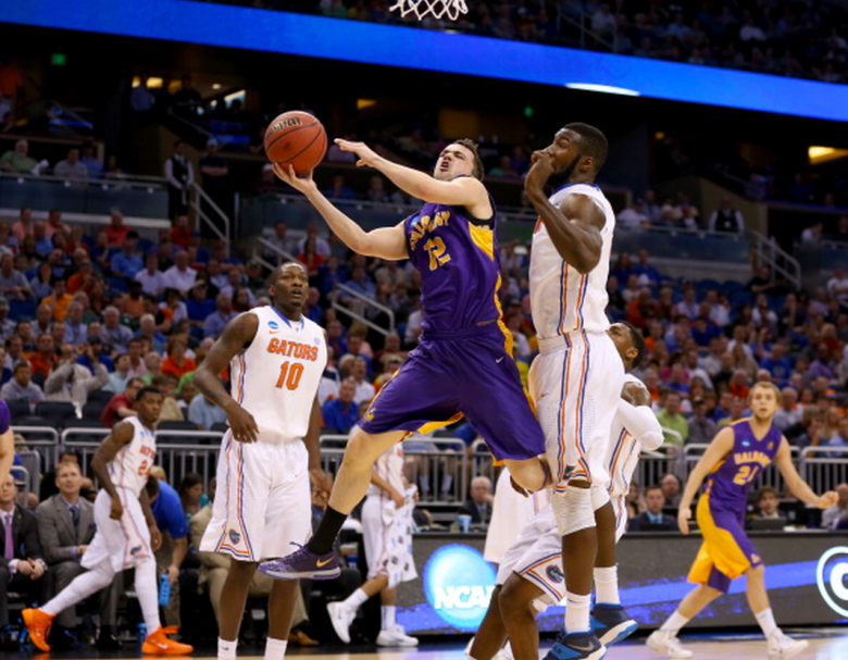 Peter Hooley #12 of the Albany Great Danes goes up for a shot against Patric Young #4 of the Florida Gators in the first half during the second round of the 2014 NCAA Men's Basketball Tournament at Amway Center on March 20, 2014 in Orlando, Florida. (Getty)