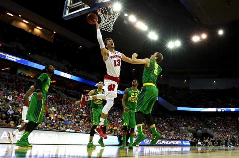 Wisconsin's Duje Dukan shoots over Oregon's Casey Benson in the first half during the third round of the 2015 NCAA Men's Basketball Tournament. (Getty)