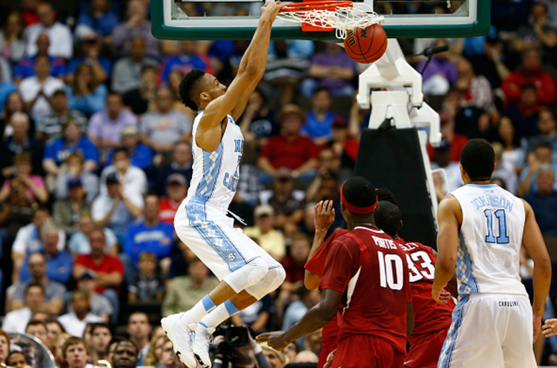North Carolina's J.P. Tokoto dunks against the Arkansas Razorbacks in the 2015 NCAA Men's Basketball Tournament. (Getty)