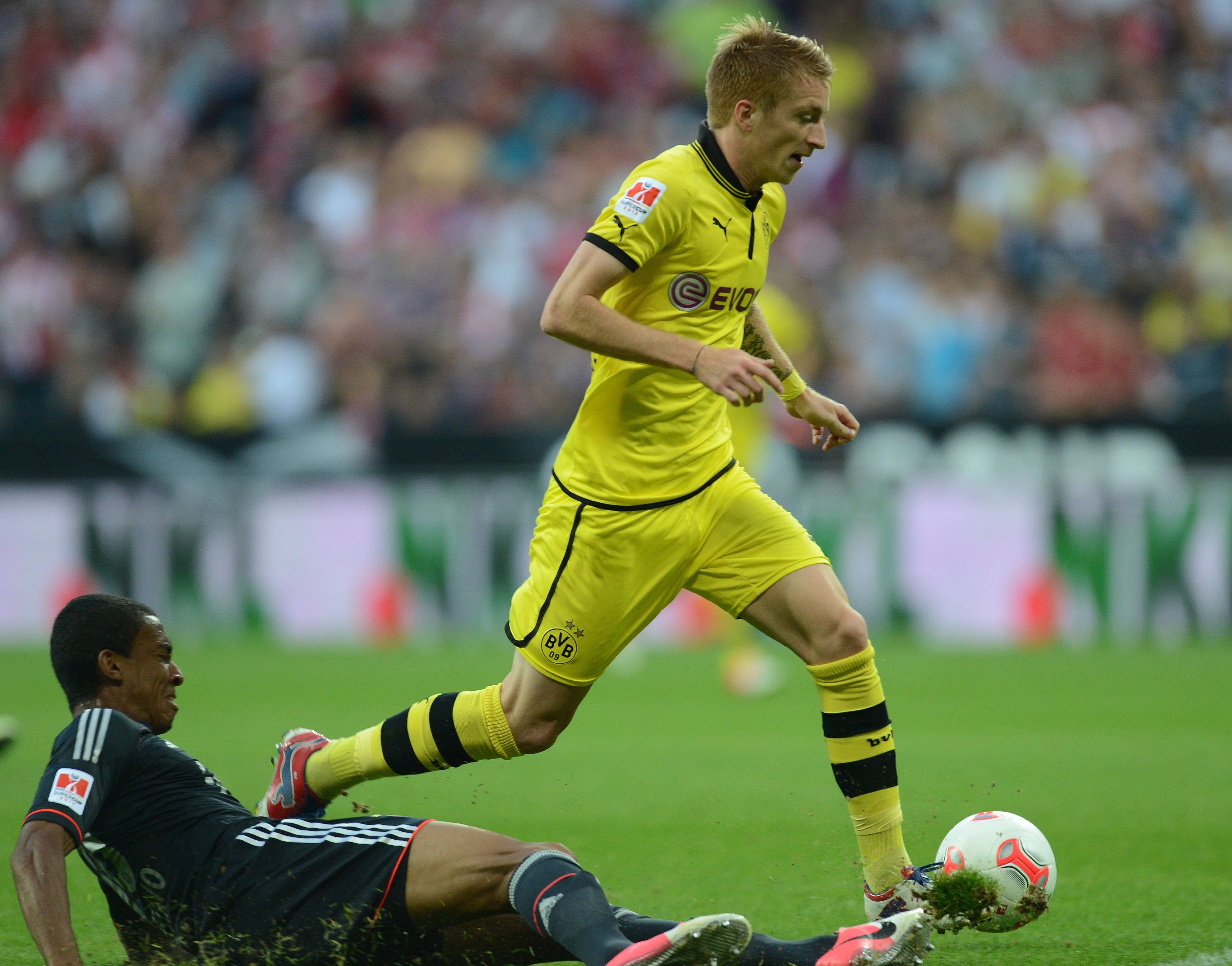  Action photo of professional German soccer player, Marco Reus, playing for Borussia Dortmund.