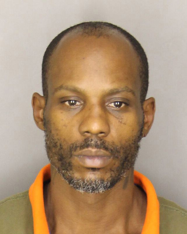  In this handout photo provided by the Greer Police Department, Rapper DMX, whose real name is Earl Simmons, is seen in a police booking photo after his arrest in 2013. (Getty)
