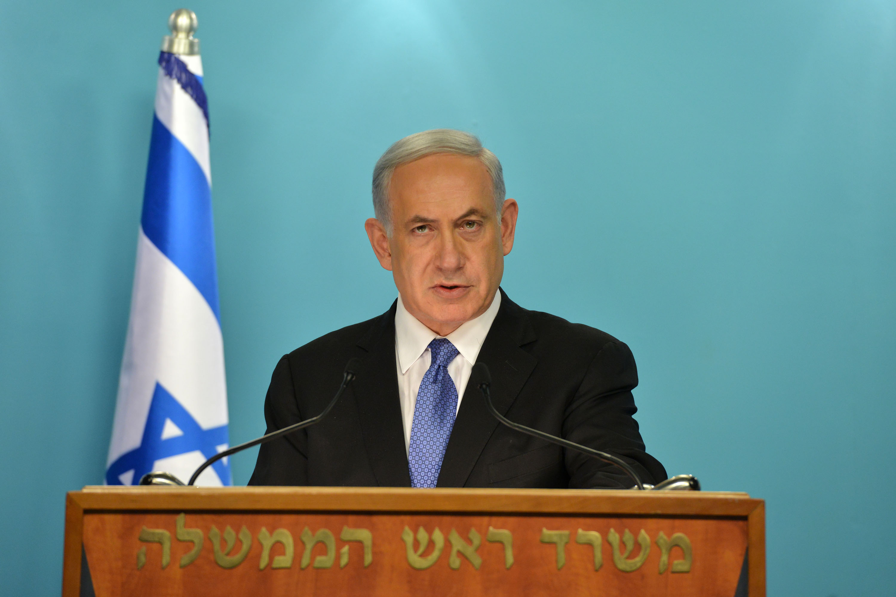 In this handout provided by the Israeli Government Press Office, Israel Prime Minister Benjamin Netanyahu (R) delivers a statement to the press on April 3, 2015. (Getty)