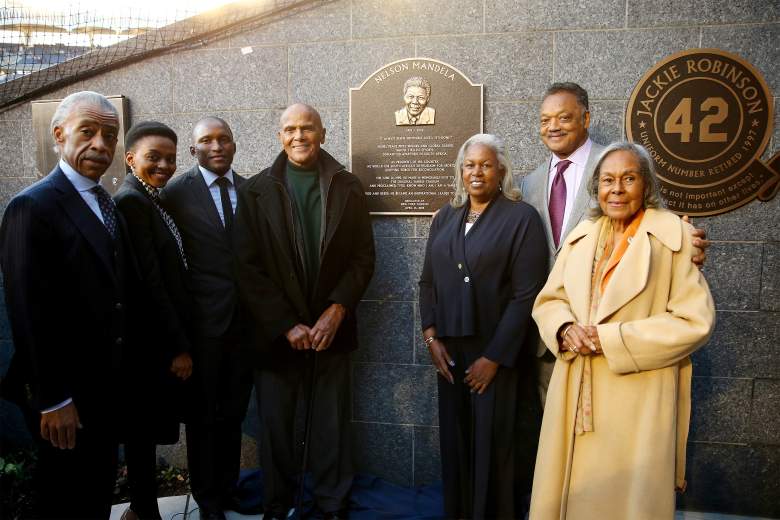 The Rev. Al Sharpton, Lindo Mandela, Zondwa Mandela, Harry Belafonte, Sharon Robinson, the Rev Jesse Jackson and Rachel Robinson, wife of the late baseball great Jackie Robinson, pose with a plaque memorializing the late South African President Nelson Mandela installed at Monument Park at Yankee Stadium in April 2014.