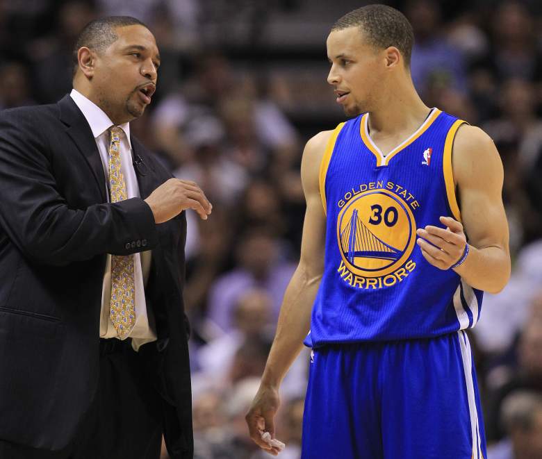 Jackson discusses strategy with Steph Curry during a contest in 2013. (Getty)