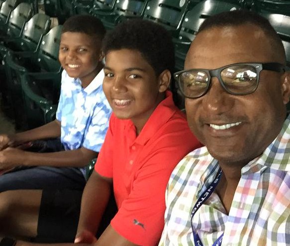 Hamilton with his sons at a baseball game. Twitter