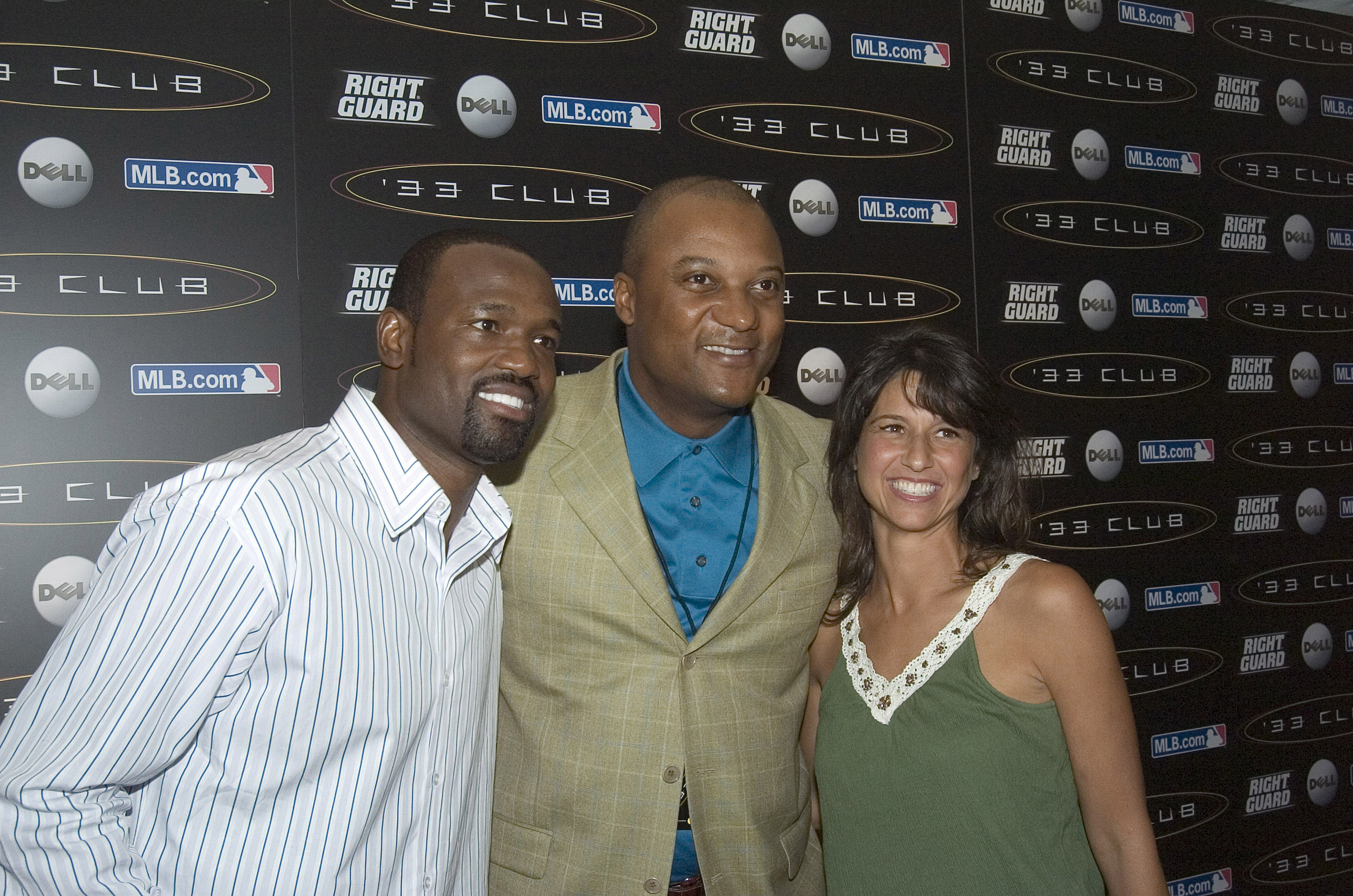 Darryl Hamilton, center, with Harold Reynolds and an unidentified woman at a 2006 event. (Getty)