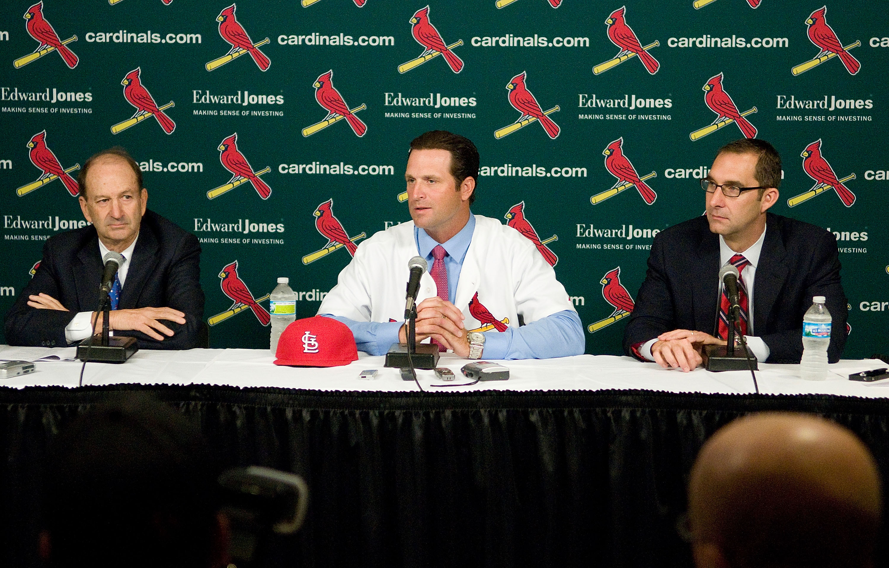 St. Louis Cardinals owner Bill Dewitt Jr., Mike Matheny, and general manager John Mozeliak talk during a press conference to announce Matheny as the new manager of the Cardinals at Busch Stadium on November 14, 2011. (Getty)