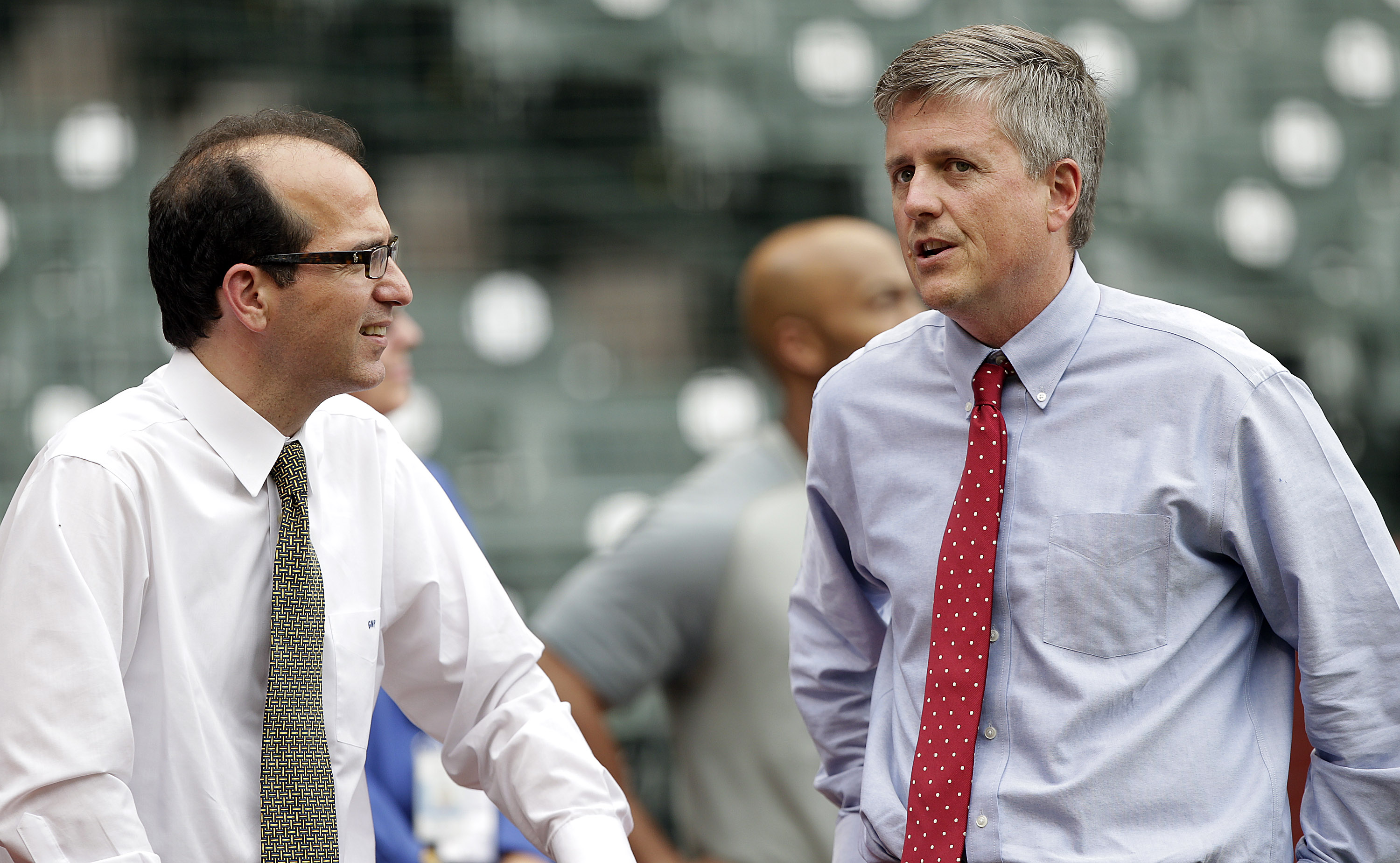 Houston Astros general manager Jeff Luhnow, right, and team president George Postolos talk during batting practice before a game between the New York Mets and Houston Astros on May 1, 2012. (Getty)