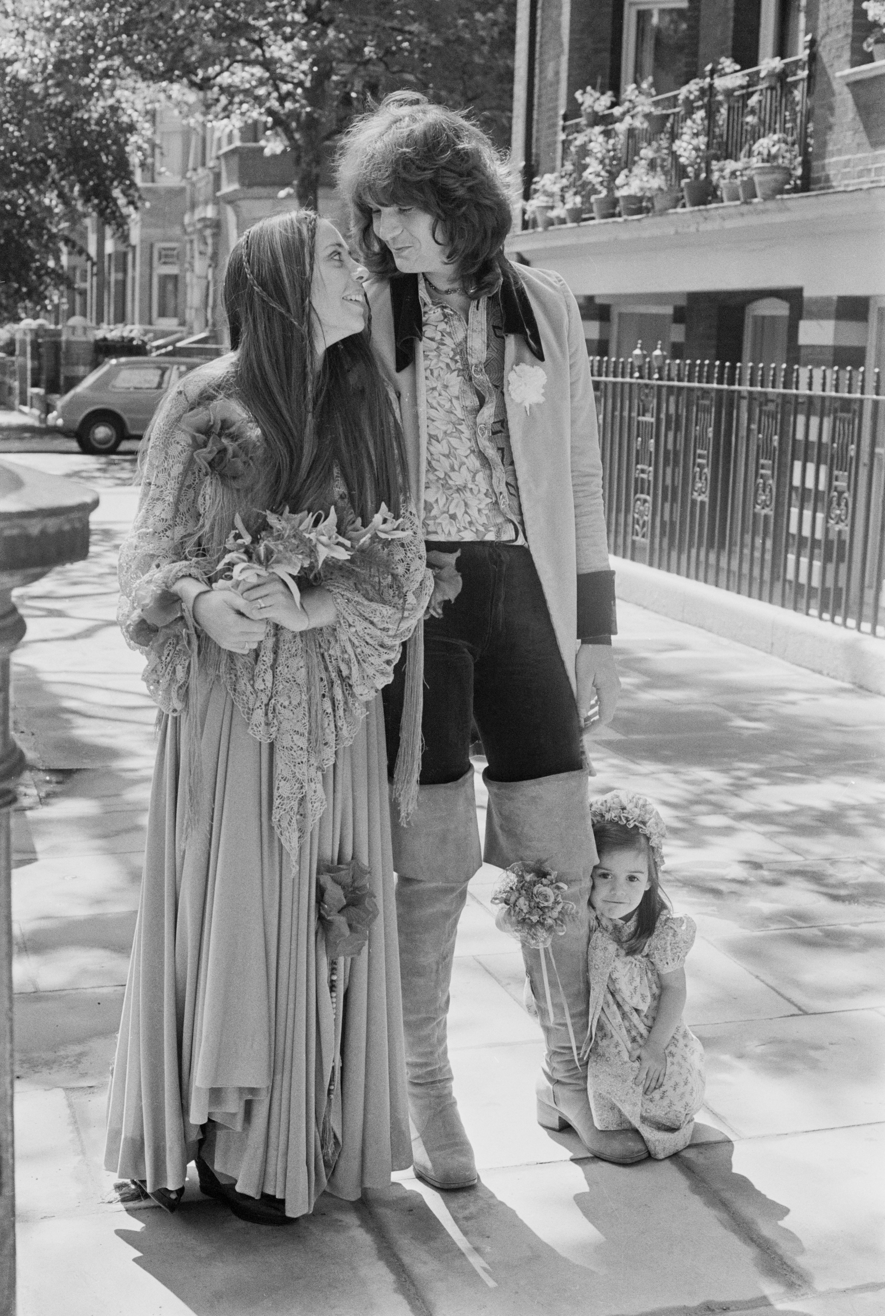 Bassist Chris Squire, of progressive rock group Yes, with model Nikki James at their wedding, June 19, 1972. On the right is James's daughter Carmen, who was one of the bridesmaids. (Getty)