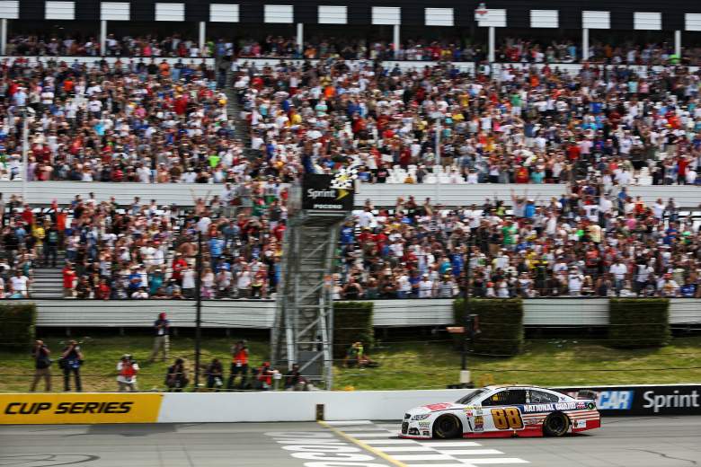 Dale Earnhardt Jr. takes the checkered flag in the 2014 spring race at Pocono Raceway. (Getty)