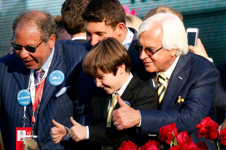 Trainer Bob Baffert of American Pharoah #18 celebrates with his son Bode and Owner Ahmed Zayat in winners circle after winning the 141st running of the Kentucky Derby. (Getty)