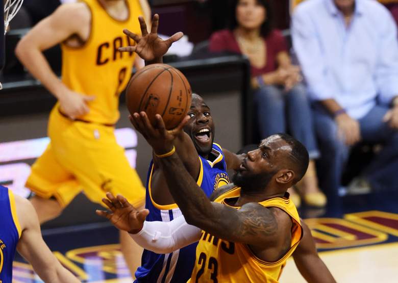 LeBron James of the Cavaliers goes up for a shot in Game 3 as Golden State's Draymond Green defends. (Getty)