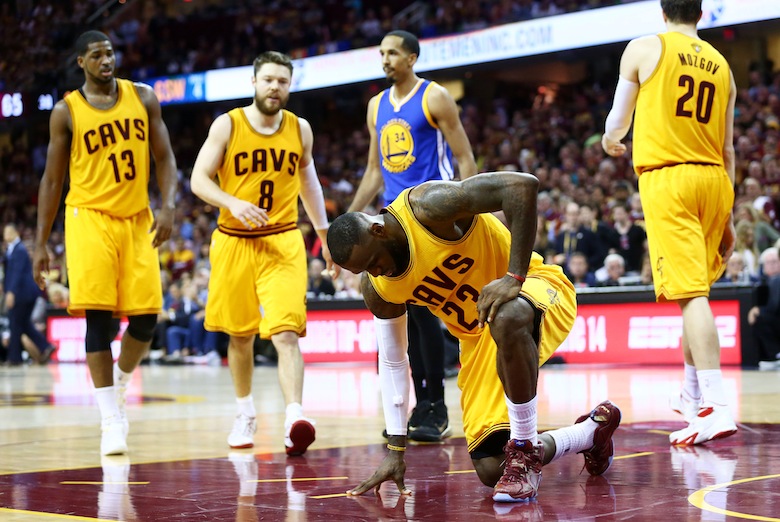 CLEVELAND, OH - JUNE 11:  LeBron James #23 of the Cleveland Cavaliers gets up after falling to the court in the third quarter against the Golden State Warriors during Game Four of the 2015 NBA Finals at Quicken Loans Arena on June 11, 2015 in Cleveland, Ohio.  NOTE TO USER: User expressly acknowledges and agrees that, by downloading and or using this photograph, user is consenting to the terms and conditions of Getty Images License Agreement.  (Photo by Ronald Martinez/Getty Images)