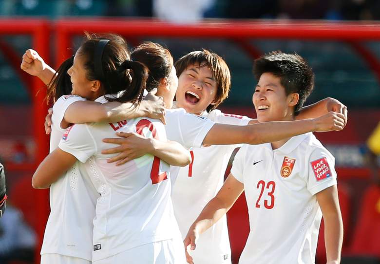 EDMONTON, AB - JUNE 20: Team members of China celebrate their win over Cameroon during the FIFA Women's World Cup Canada Round 16 match between China and Cameroon at Commonwealth Stadium on June 20, 2015 in Edmonton, Alberta, Canada. (Photo by Todd Korol/Getty Images)