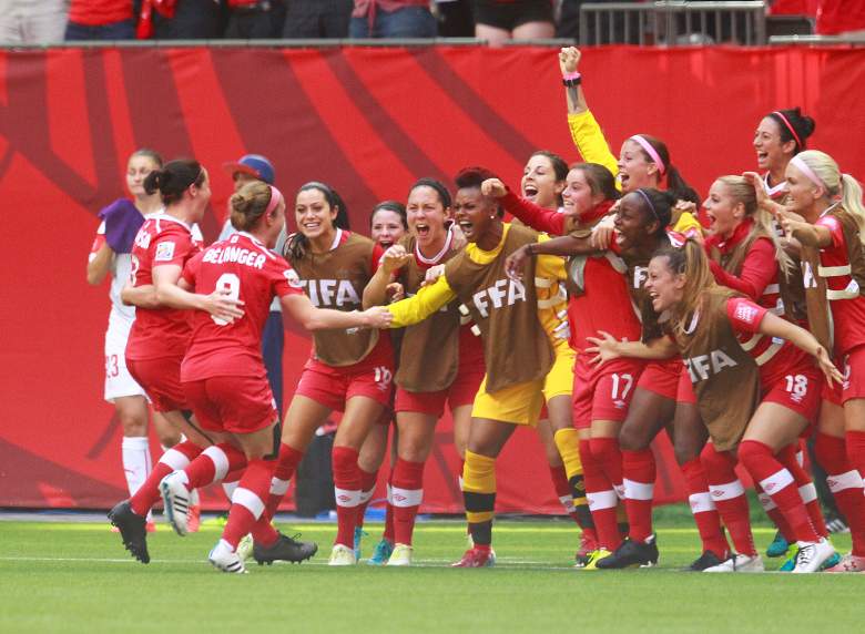 Team Canada celebrates Josee Belanger's in the Round of 16 win. (Getty) 