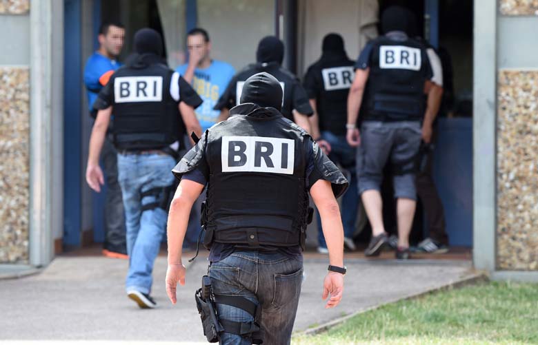 Special forces of France's Research and Intervention Brigades (BRI) arrive at Sahli's apartment. (Getty)
