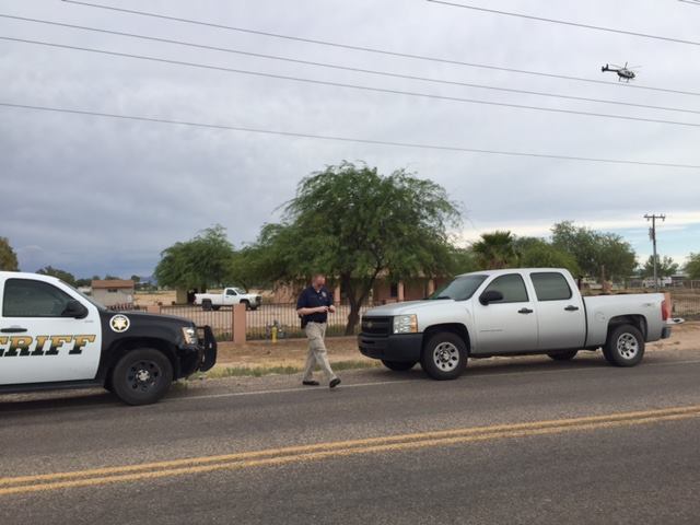 Police  at the property where the two bodies were found. (Pinal County Sheriff's Office via Facebook)