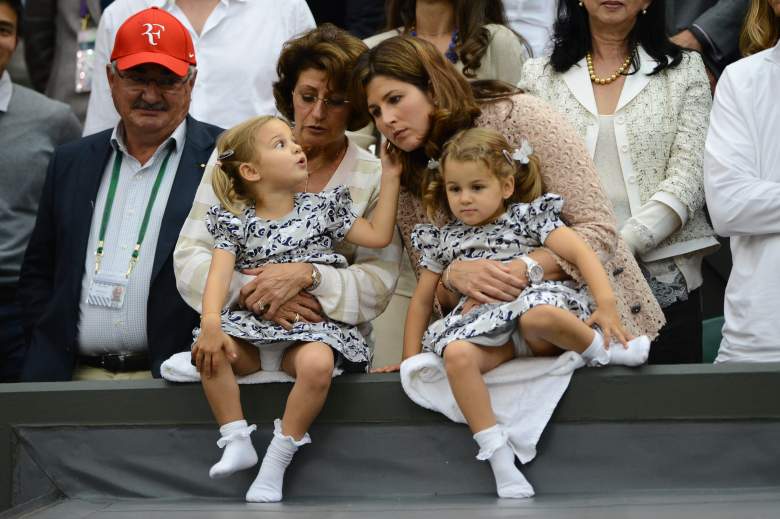 Mirka Federer (centre right), wife of Switzerland's Roger Federer stands with their twin two year old daughters Myla Rose and Charlene Riva in the family box on Center Court after his men's singles final victory over Britain's Andy Murray on day 13 of the 2012 Wimbledon Championships tennis tournament at the All England Tennis Club in Wimbledon, southwest London, on July 8, 2012. Federer won the match 4-6, 7-5, 6-3, 6-4. AFP PHOTO/ LEON NEAL    RESTRICTED TO EDITORIAL USE        (Photo credit should read LEON NEAL/AFP/GettyImages)