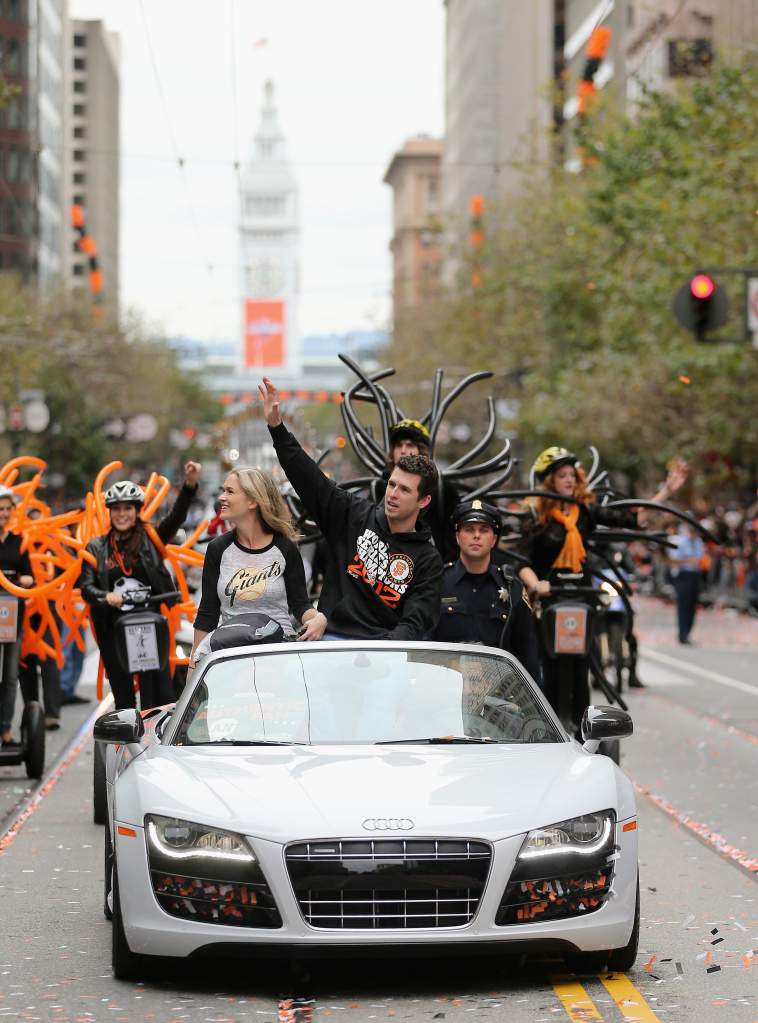 SAN FRANCISCO, CA - OCTOBER 31:  Buster Posey #28 of the San Francisco Giants waves to the crowd during the San Francisco Giants World Series victory parade on October 31, 2012 in San Francisco, California. The San Francisco Giants beat the Detroit Tigers to win the 2012 World Series.  (Photo by Ezra Shaw/Getty Images)