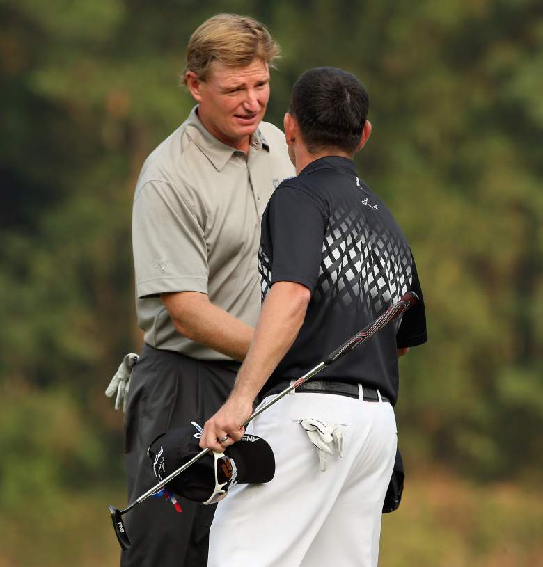 SHENZHEN, CHINA - NOVEMBER 03:  Ernie Els (left) and Louis Oosthuizen of South Africa shake hands on the 18th hole during the third round of the WGC HSBC Champions at the Mission Hills Resort on November 3, 2012 in Shenzhen, China.  (Photo by Andrew Redington/Getty Images)