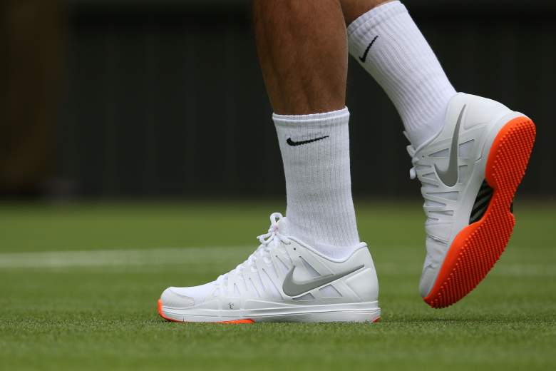 LONDON, ENGLAND - JUNE 24:  Roger Federer of Switzerland' trainers during his gentlemen's singles first round match against Victor Hanescu of Romania on day one of the Wimbledon Lawn Tennis Championships at the All England Lawn Tennis and Croquet Club on June 24, 2013 in London, England.  (Photo by Clive Brunskill/Getty Images)