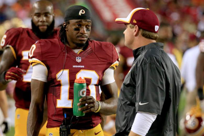 LANDOVER, MD - AUGUST 18: Quarterback Robert Griffin III #10 of the Washington Redskins talks with head coach Jay Gruden of the Washington Redskins  during a preseason game against the Cleveland Browns at FedExField on August 18, 2014 in Landover, Maryland.  (Photo by Rob Carr/Getty Images)