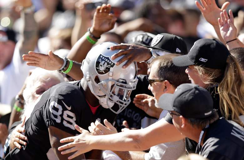 OAKLAND, CA - OCTOBER 12:  James Jones #89 of the Oakland Raiders jumps into the crowd after catching a touchdown pass against the San Diego Chargers at O.co Coliseum on October 12, 2014 in Oakland, California.  (Photo by Ezra Shaw/Getty Images)
