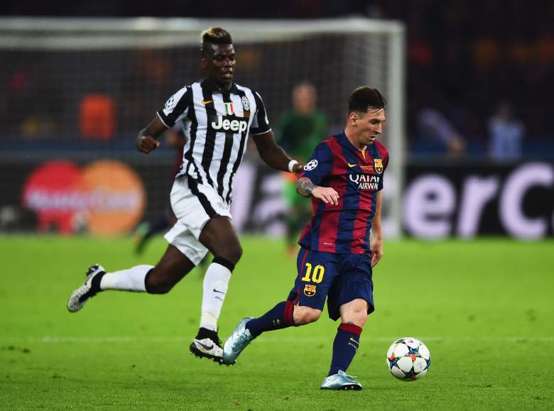 BERLIN, GERMANY - JUNE 06: Lionel Messi of Barcelona goes past Paul Pogba of Juventus during the UEFA Champions League Final between Juventus and FC Barcelona at Olympiastadion on June 6, 2015 in Berlin, Germany. (Photo by Laurence Griffiths/Getty Images)