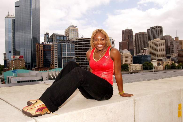 MELBOURNE, AUSTRALIA:  Serena Williams displays some of the latest products from her sponsor Puma in front of the Melbourne skyline, 13 January 2002, on the eve of the Australian Open. Williams is struggling with an angle injury she suffered this past week in Sydney as she prepares for the tournament, which takes place in Melbourne 14-27 January.   AFP PHOTO/WILLIAM WEST (Photo credit should read WILLIAM WEST/AFP/Getty Images)