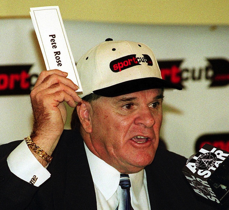 Pete Rose uses his name tag to make a point about a petition which he launched on the Internet designed to convince Major League Baseball that he be reinstated and allowed to participate in baseball. (HENNY RAY ABRAMS/AFP/Getty Images)