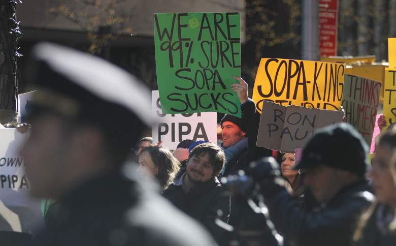 NEW YORK, NY - JANUARY 18:  Protesters demonstrate against the proposed Stop Online Piracy Act (SOPA) and Protect IP Act (PIPA) outside the offices of U.S. Sen. Charles Schumer (D-NY) and U.S. Sen. Kirsten Gillibrand (D-NY) on January 18, 2012 in New York City.  The controversial legislation is aimed at preventing piracy of media but those opposed believe it will support censorship.    (Photo by Mario Tama/Getty Images)