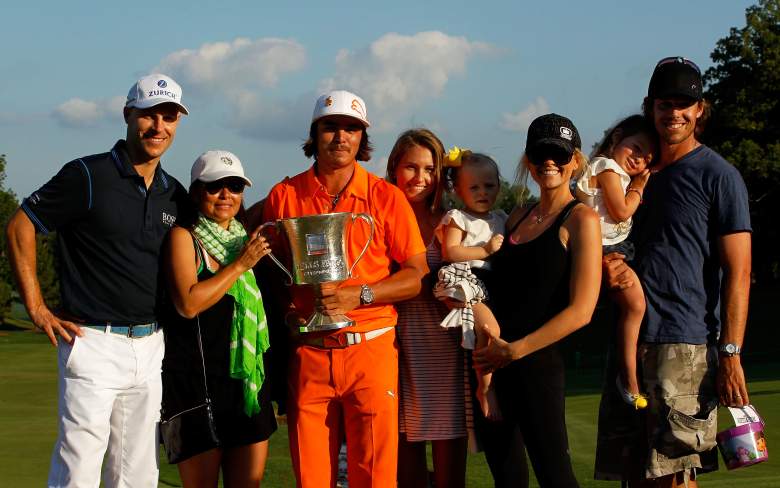 CHARLOTTE, NC - MAY 06:  Rickie Fowler (3rd L) of the United States celebrates with the championship trophy alongside his mother Lynne Fowler (2nd L), girlfriend Alexandra Brown (4th L), golfer Ben Crane (L), golfer Aaron Baddeley (R) and his wife Richelle Baddeley (3rd R) after defeating Rory McIlroy of Northern Ireland and D.A. Points of the United States in a playoff during the final round to win the Wells Fargo Championship at the Quail Hollow Club on May 6, 2012 in Charlotte, North Carolina.  (Photo by Streeter Lecka/Getty Images)