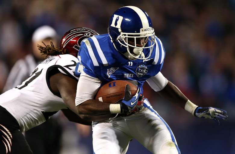 CHARLOTTE, NC - DECEMBER 27: Camerron Cheatham #21 of the Cincinnati Bearcats tries to stop Jamison Crowder #3 of the Duke Blue Devils during their game at Bank of America Stadium on December 27, 2012 in Charlotte, North Carolina. (Photo by Streeter Lecka/Getty Images)