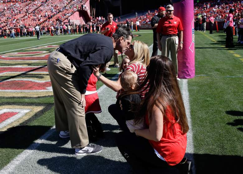SAN FRANCISCO, CA - OCTOBER 13: Head coach Jim Harbaugh of the San Francisco 49ers kisses his wife Sarah Feuerborn Harbaugh before their game against the Arizona Cardinals at Candlestick Park on October 13, 2013 in San Francisco, California. (Photo by Ezra Shaw/Getty Images)