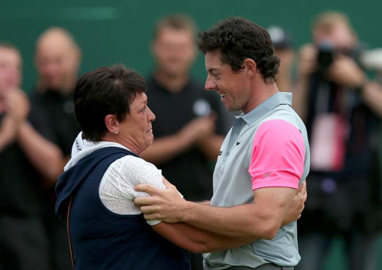 Northern Ireland's Rory McIlroy celebrates with his mother Rosie on the 18th green winning the Open Championship after his fourth round 71, on the final day of the 2014 British Open Golf Championship at Royal Liverpool Golf Course in Hoylake, north west England on July 20, 2014. McIlroy won the British Open at Royal Liverpool Golf Course in Hoylake with a final round of 71. The 25-year-old Northern Irishman won with a seventeen under par total of 271, two strokes clear of Rickie Fowler and Sergio Garcia. AFP PHOTO / ANDREW YATES (Photo credit should read ANDREW YATES/AFP/Getty Images)