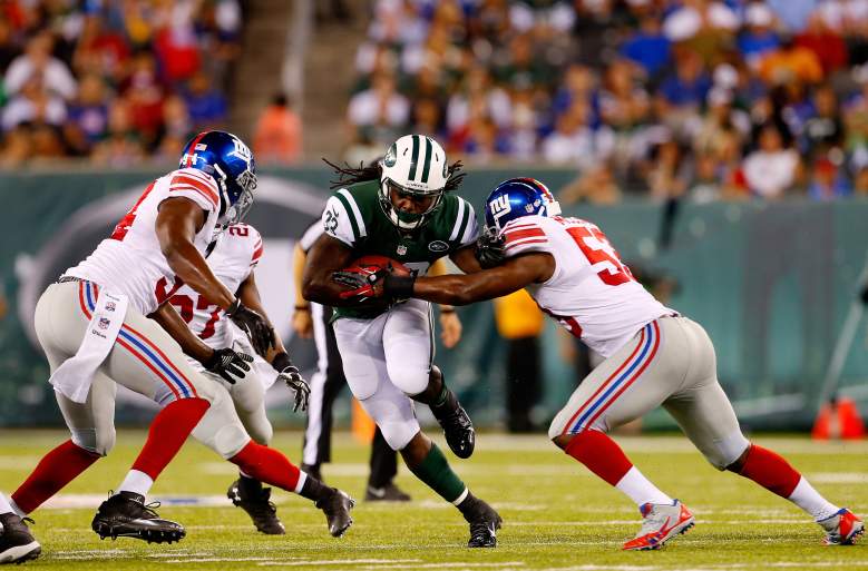 EAST RUTHERFORD, NJ - AUGUST 22: Chris Ivory #33 of the New York Jets runs the ball against Jameel McClain #53 of the New York Giants during a preseason game at MetLife Stadium on August 22, 2014 in East Rutherford, New Jersey. (Photo by Rich Schultz/Getty Images)