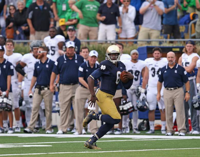 SOUTH BEND, IN - AUGUST 30: Malik Zaire #8 of the Notre Dame Fighting Irish runs 56 yards on his very first collegiate play against the Rice Owls at Notre Dame Stadium on August 30, 2014 in South Bend, Indiana. Notre Dame defeated Rice 48-17. (Photo by Jonathan Daniel/Getty Images)
