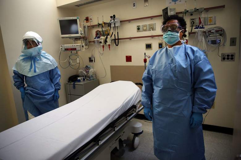 Members of Bellevue Hospital staff wear protective clothing as they demonstrate how they would receive a suspected Ebola patient on October 8, 2014 in New York City. If the patient was confirmed to be carrying the deadly virus the person would be sent to an isolation unit for treatment. The first person diagnosed with Ebola in the United States, Liberian Thomas Duncan, has died at a Dallas hospital, Texas Health Presbyterian Hospital said.  (Getty Images)