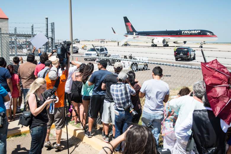 Citizens watch as Republican Presidential candidate and business mogul Donald Trump leaves in his plane after his trip to the border on July 23, 2015 in Laredo, Texas. Trump's recent comments, calling some immigrants from Mexico as drug traffickers and rapists, have stirred up reactions on both sides of the aisle. Although fellow Republican presidential candidate Rick Perry has denounced Trump's comments and his campaign in general, U.S. Senator from Texas Ted-Cruz has so far refused to bash his fellow Republican nominee. (Getty Images)