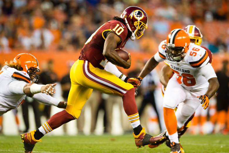 CLEVELAND, OH - AUGUST 13: Quarterback Robert Griffin III #10 of the Washington Redskins runs for a gain before being tacked by inside linebacker Karlos Dansby #56 of the Cleveland Browns during the first half at FirstEnergy Stadium on August 13, 2015 in Cleveland, Ohio. (Photo by Jason Miller/Getty Images)