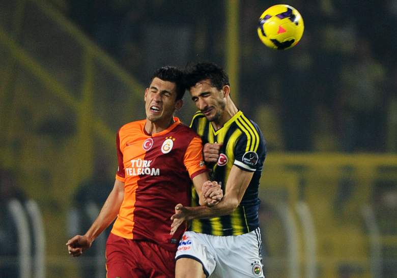 Fenerbahce midfielder Mehmet Topal (right) was shot on Tuesday afternoon in Istanbul, Turkey amid terrorist activity in the area. (Getty)