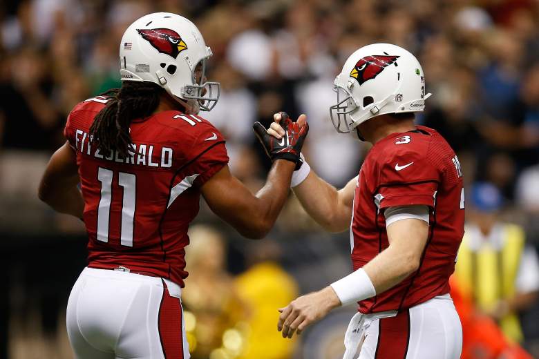 Cardinals quarterback Carson Palmer, right, and receiver Larry Fitzgerald have been one of the most productive duos in 2015. (Getty)