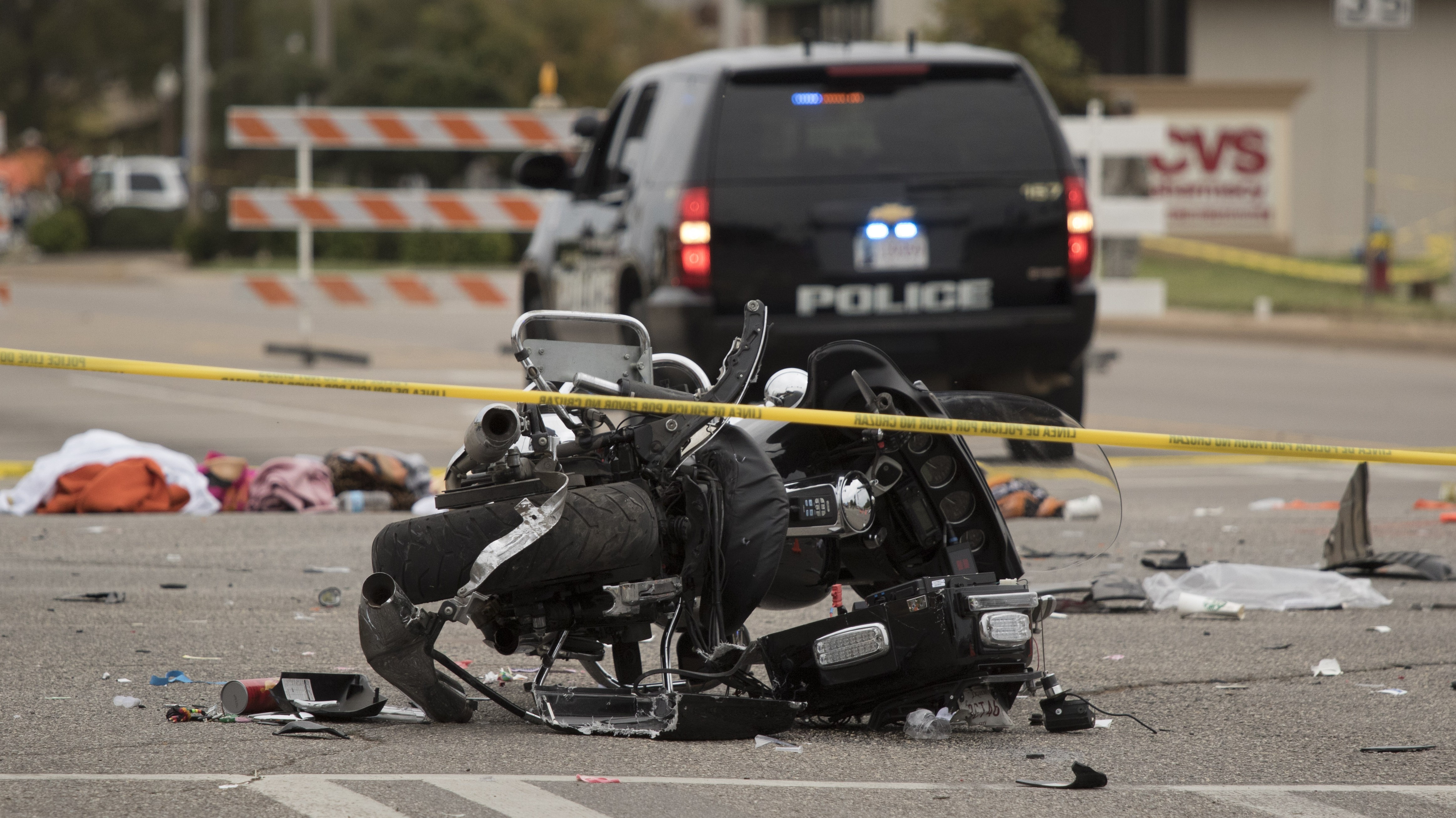 A wrecked police motorcycle lays on the scene after a suspected drunk driver crashed into a crowd of spectators during the Oklahoma State University homecoming parade near the Boone Pickens Stadium.(Getty)