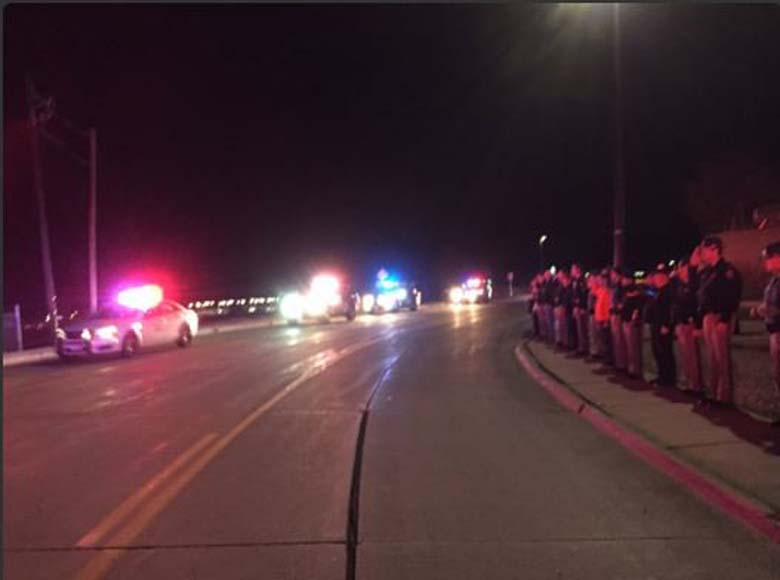 Colorado State Police line the streets in honor of their fallen colleague. (Twitter)