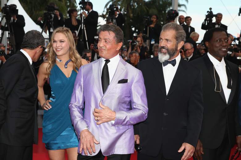 Rousey attends The Expendables 3 premiere with Sylvester Stallone, Mel Gibson and Wesley Snipes. (Getty)