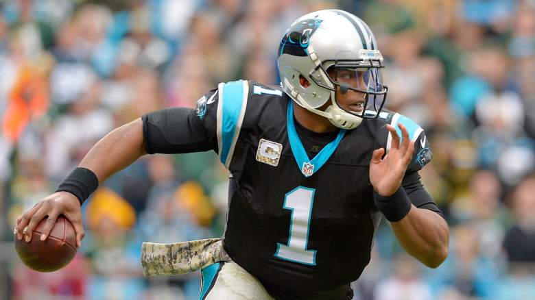 Panthers quarterback Cam Newton is getting it done with both his arm and legs. (Getty)