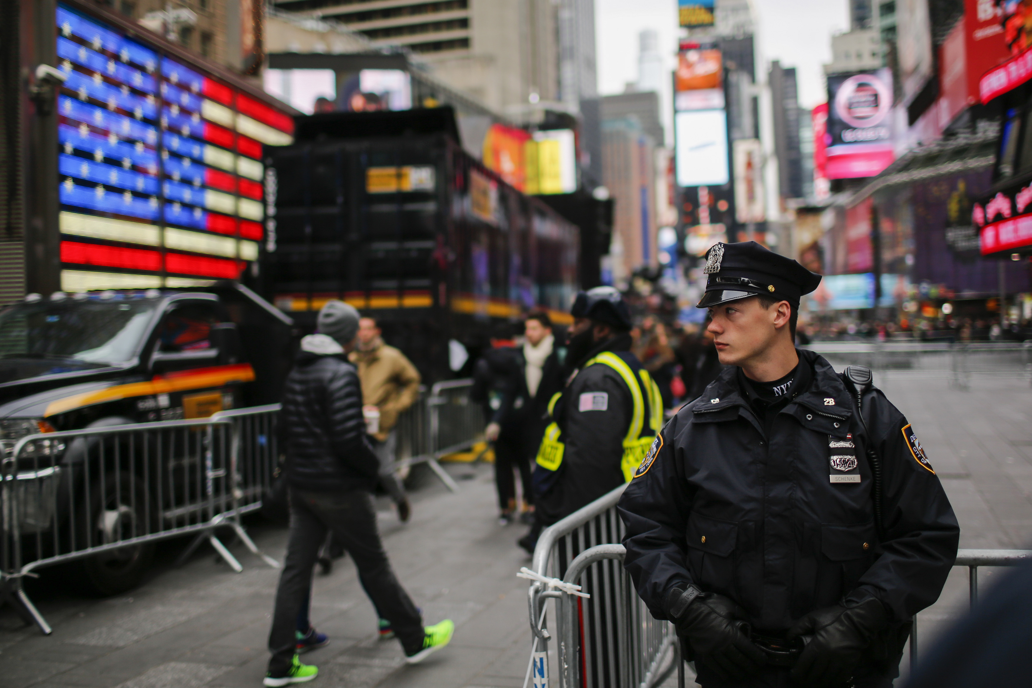 New York Police Officers keeps an eye on people at Times Square before New Year's Eve celebrations on December 31, 2015. (Getty)